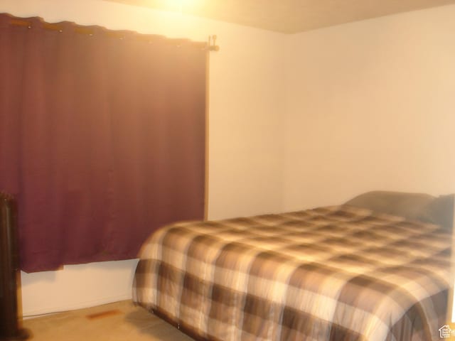 281 E 7th St S Unit 8, Ogden, UT 84404 - bedroom featuring light colored carpet