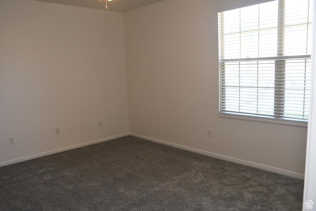 3072 W Leisure Villas Ct, West Jordan, UT 84084 - spare room featuring dark colored carpet and ceiling fan