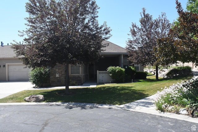 3072 W Leisure Villas Ct, West Jordan, UT 84084 - obstructed view of property with a garage, a front yard, driveway, and a shingled roof