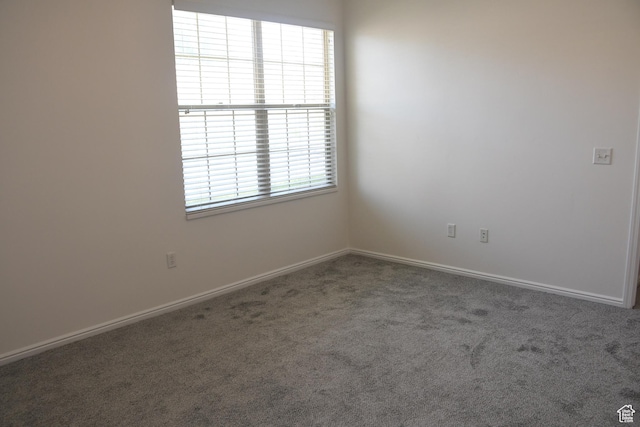 3072 W Leisure Villas Ct, West Jordan, UT 84084 - carpeted spare room featuring baseboards