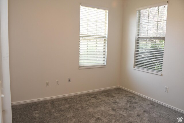 3072 W Leisure Villas Ct, West Jordan, UT 84084 - carpeted spare room featuring baseboards
