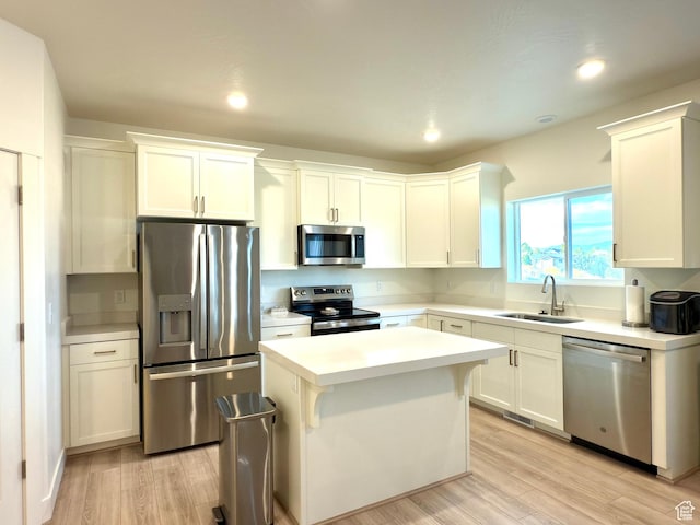 7494 N Silver Ridge Rd Unit 3466, Eagle Mountain, UT 84005 - kitchen featuring stainless steel appliances, a center island, light countertops, light wood finished floors, and recessed lighting
