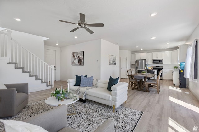 7494 N Silver Ridge Rd Unit 3466, Eagle Mountain, UT 84005 - living room featuring light wood-type flooring, a ceiling fan, stairway, and recessed lighting