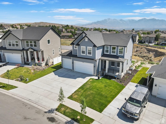 7494 N Silver Ridge Rd Unit 3466, Eagle Mountain, UT 84005 - view of front of property featuring a residential view, an attached garage, concrete driveway, and a mountain view