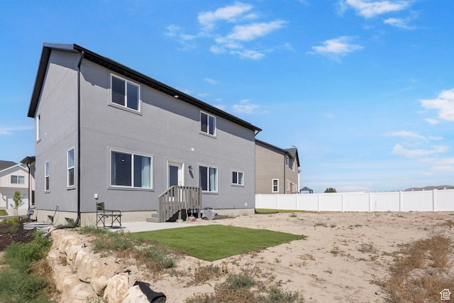 7494 N Silver Ridge Rd Unit 3466, Eagle Mountain, UT 84005 - rear view of house featuring stucco siding