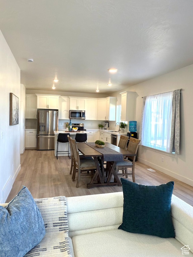 7494 N Silver Ridge Rd Unit 3466, Eagle Mountain, UT 84005 - dining space with light wood-style floors and recessed lighting