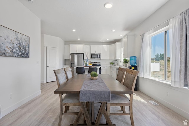 7494 N Silver Ridge Rd Unit 3466, Eagle Mountain, UT 84005 - dining room featuring light wood-style flooring and recessed lighting