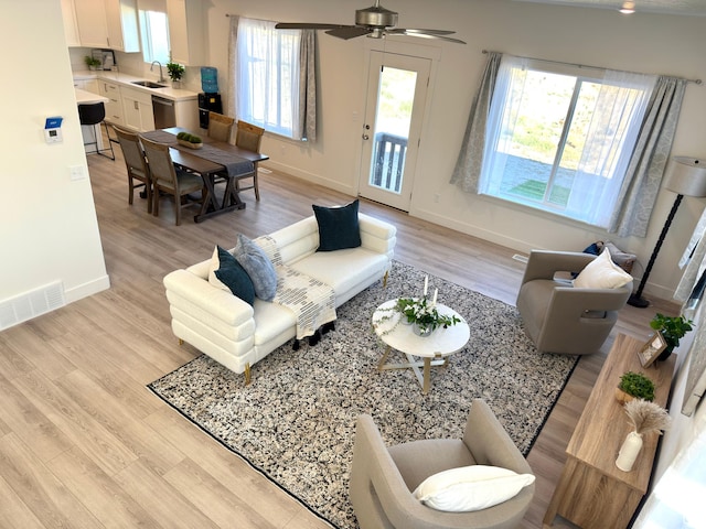 7494 N Silver Ridge Rd Unit 3466, Eagle Mountain, UT 84005 - living area featuring light wood finished floors and ceiling fan