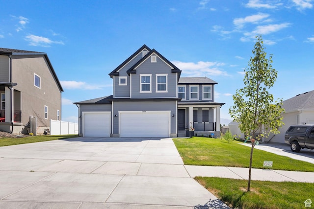 7494 N Silver Ridge Rd Unit 3466, Eagle Mountain, UT 84005 - view of front facade with a garage, a front lawn, and concrete driveway