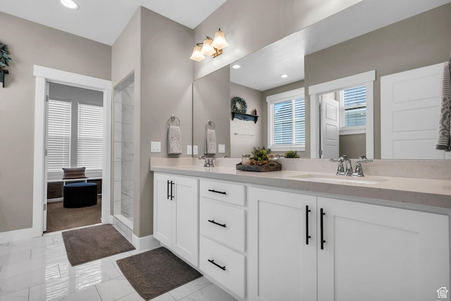 2873 S Puddle Ln, Saratoga Springs, UT 84045 - bathroom featuring double vanity, marble look tiles, tiled shower, and recessed lighting