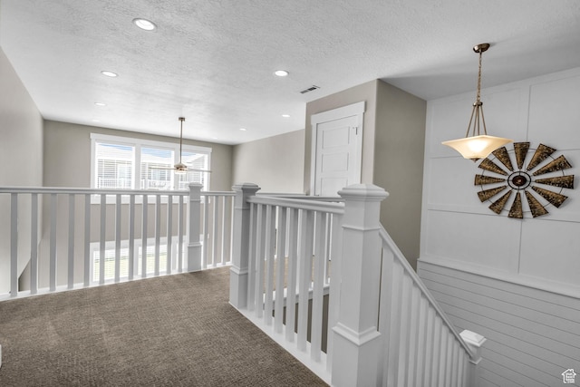 2873 S Puddle Ln, Saratoga Springs, UT 84045 - hallway featuring an upstairs landing, a decorative wall, a textured ceiling, recessed lighting, and carpet flooring