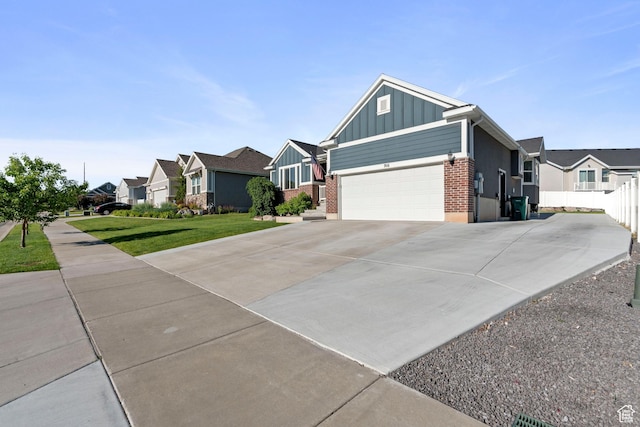916 Cold Creek Way, Layton, UT 84041 - ranch-style house featuring board and batten siding, brick siding, a residential view, and concrete driveway