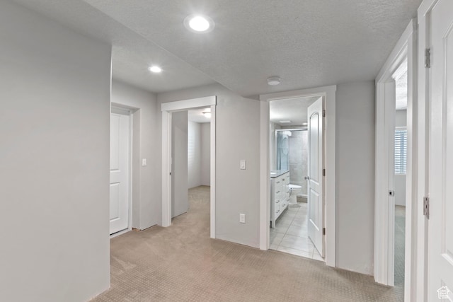 916 Cold Creek Way, Layton, UT 84041 - corridor featuring light colored carpet, recessed lighting, and a textured ceiling