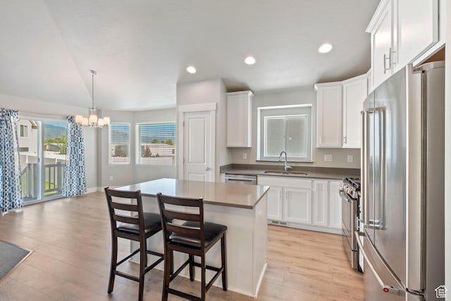 916 Cold Creek Way, Layton, UT 84041 - kitchen featuring stainless steel appliances, a chandelier, white cabinets, and recessed lighting