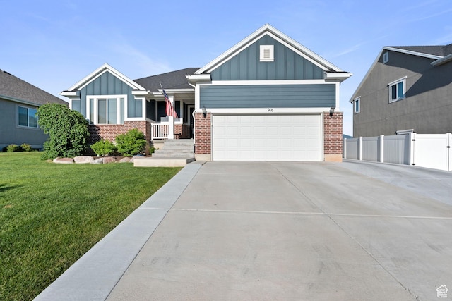 916 Cold Creek Way, Layton, UT 84041 - view of front of house featuring board and batten siding, brick siding, concrete driveway, and a garage