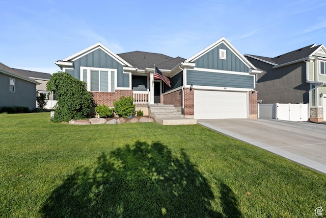 916 Cold Creek Way, Layton, UT 84041 - view of front facade featuring board and batten siding, brick siding, and driveway