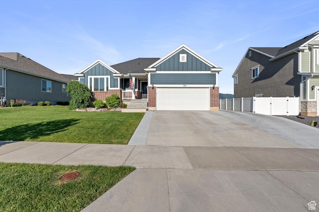 916 Cold Creek Way, Layton, UT 84041 - view of front facade with board and batten siding, brick siding, driveway, and an attached garage