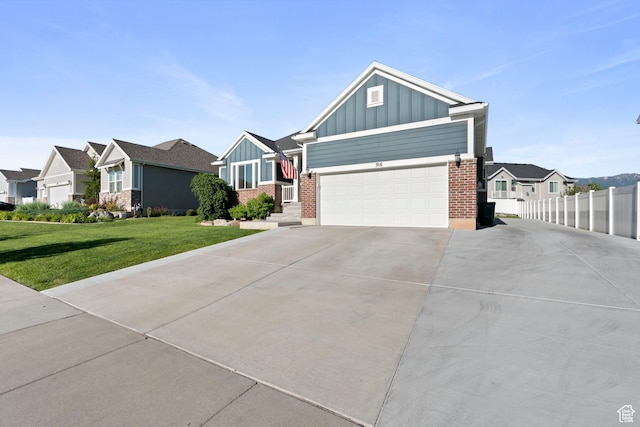 916 Cold Creek Way, Layton, UT 84041 - craftsman house featuring board and batten siding, driveway, brick siding, and a residential view