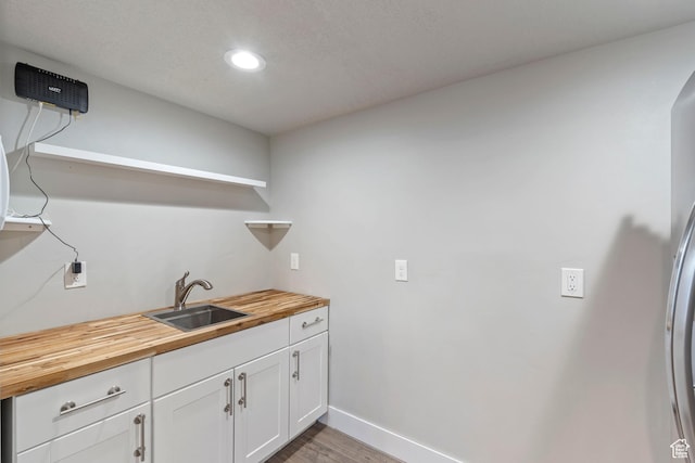 916 Cold Creek Way, Layton, UT 84041 - washroom with recessed lighting, wood finished floors, and cabinet space