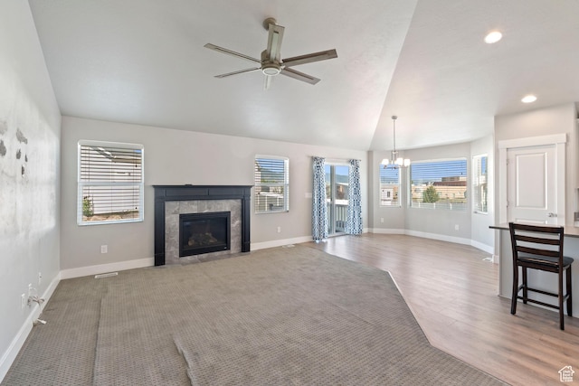 916 Cold Creek Way, Layton, UT 84041 - unfurnished living room with a chandelier, a ceiling fan, a fireplace, wood finished floors, and lofted ceiling