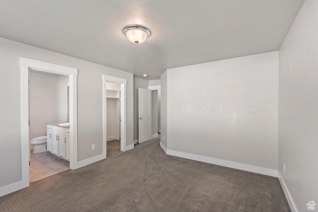 916 Cold Creek Way, Layton, UT 84041 - unfurnished bedroom with light colored carpet, a spacious closet, a closet, and ensuite bath