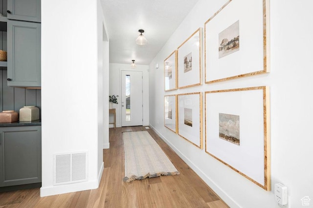 6556 S Jefferson St Unit 15, Murray, UT 84107 - hallway featuring light wood finished floors and baseboards