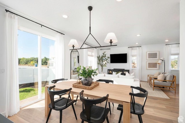 6556 S Jefferson St Unit 15, Murray, UT 84107 - dining room featuring recessed lighting, light wood-style flooring, and a chandelier