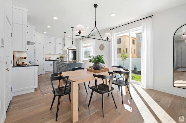 6556 S Jefferson St Unit 15, Murray, UT 84107 - dining space with light wood-style flooring and recessed lighting