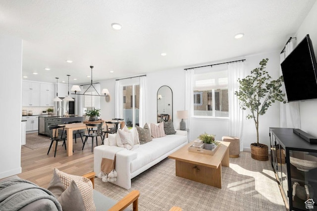 6556 S Jefferson St Unit 15, Murray, UT 84107 - living room featuring healthy amount of natural light, light wood-style flooring, and recessed lighting