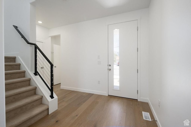 6556 S Jefferson St Unit 15, Murray, UT 84107 - foyer entrance featuring light wood-style flooring, stairway, and recessed lighting