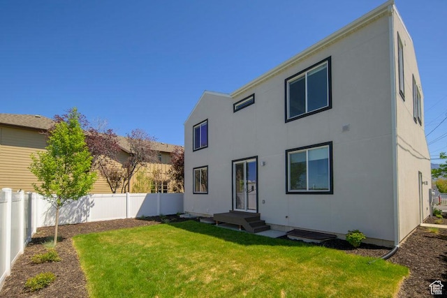 6556 S Jefferson St Unit 15, Murray, UT 84107 - back of property featuring a fenced backyard and stucco siding