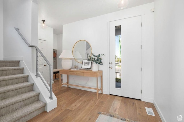 6556 S Jefferson St Unit 15, Murray, UT 84107 - entryway featuring wood finished floors, plenty of natural light, and stairs