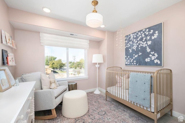 6556 S Jefferson St Unit 15, Murray, UT 84107 - bedroom featuring baseboards and a nursery area
