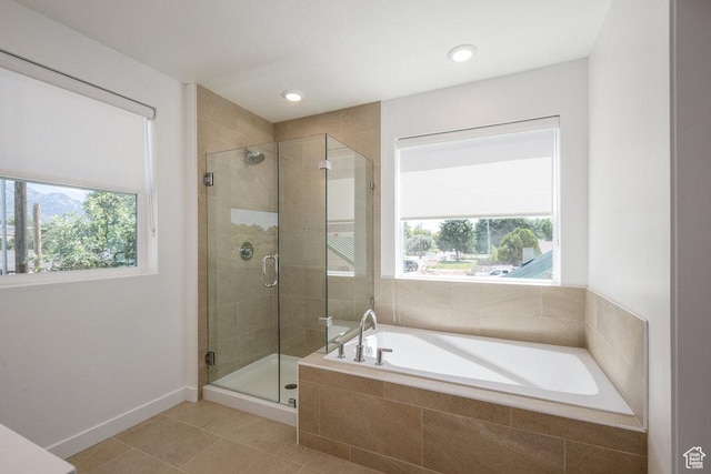 6556 S Jefferson St Unit 15, Murray, UT 84107 - bathroom with healthy amount of natural light, a garden tub, a stall shower, tile patterned flooring, and recessed lighting