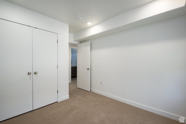 6556 S Jefferson St Unit 15, Murray, UT 84107 - unfurnished bedroom featuring light carpet and a closet