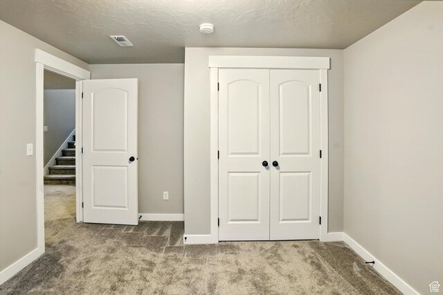 847 N 2125 W, Layton, UT 84041 - unfurnished bedroom with carpet flooring, a closet, and a textured ceiling