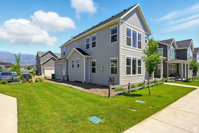 847 N 2125 W, Layton, UT 84041 - view of side of home featuring a mountain view, a yard, and a residential view