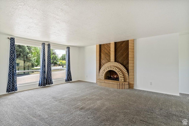 1128 W 4650 S, Riverdale, UT 84405 - unfurnished living room with a textured ceiling, carpet, and a fireplace