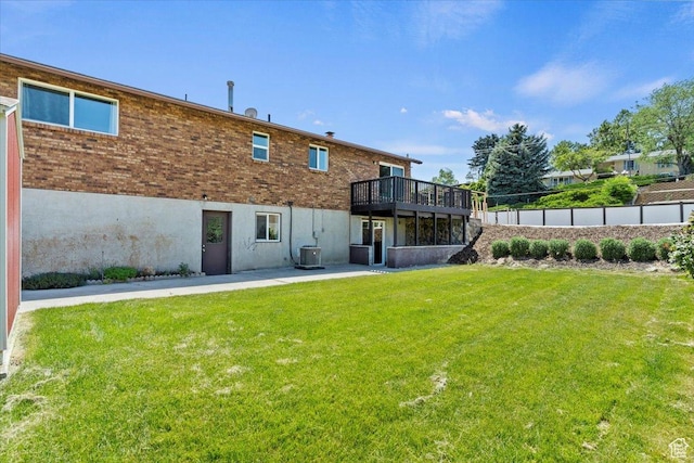 1128 W 4650 S, Riverdale, UT 84405 - back of house with a yard, a wooden deck, and brick siding
