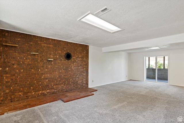 1128 W 4650 S, Riverdale, UT 84405 - carpeted spare room with a textured ceiling and brick wall
