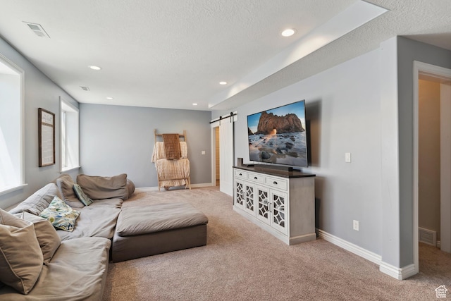 163 Cold Creek Way, Layton, UT 84041 - living room featuring carpet, a textured ceiling, a barn door, and recessed lighting