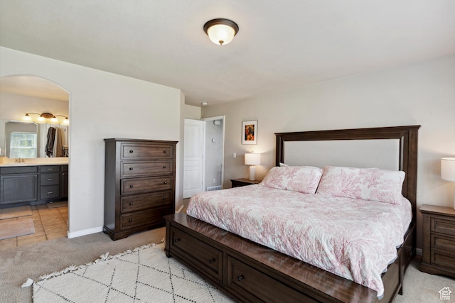 163 Cold Creek Way, Layton, UT 84041 - bedroom with light colored carpet, arched walkways, and connected bathroom