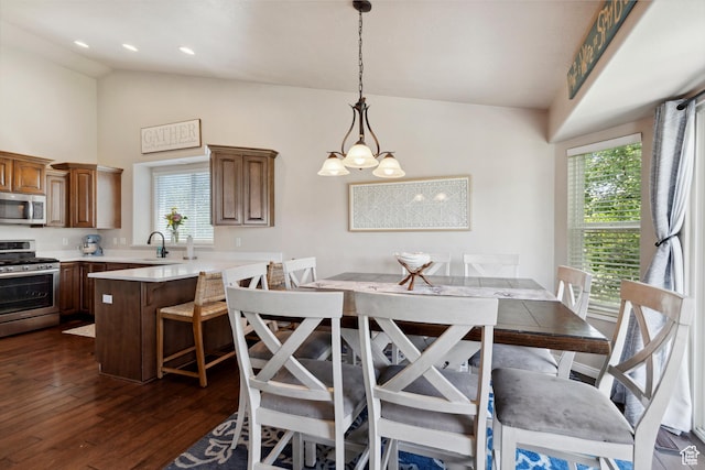 163 Cold Creek Way, Layton, UT 84041 - dining space featuring plenty of natural light, dark wood finished floors, a chandelier, and high vaulted ceiling