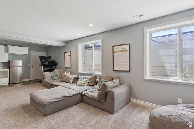 163 Cold Creek Way, Layton, UT 84041 - living area featuring light carpet, healthy amount of natural light, and recessed lighting