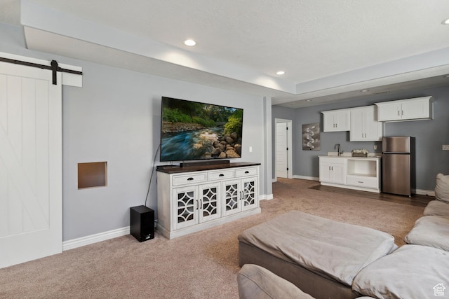 163 Cold Creek Way, Layton, UT 84041 - living room featuring light carpet, a barn door, and recessed lighting