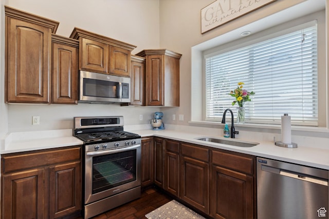 163 Cold Creek Way, Layton, UT 84041 - kitchen featuring appliances with stainless steel finishes, light countertops, and dark wood-style flooring