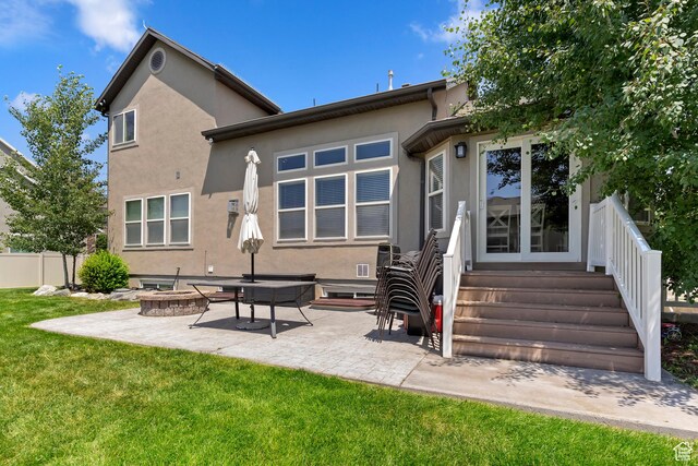 163 Cold Creek Way, Layton, UT 84041 - rear view of house featuring stucco siding, a patio, and a fire pit