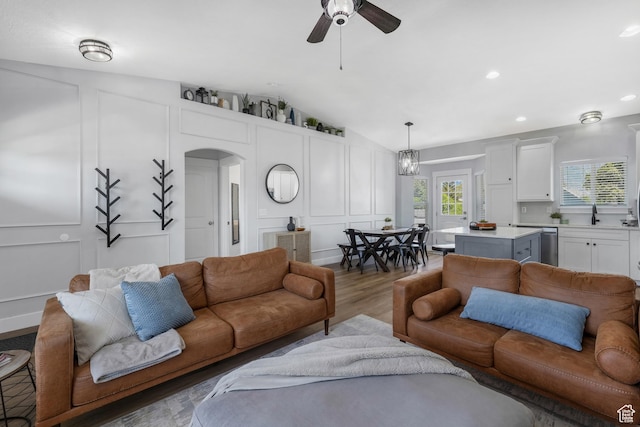 450 N 200 E, Lehi, UT 84043 - living area featuring a decorative wall, arched walkways, ceiling fan, lofted ceiling, and wood finished floors
