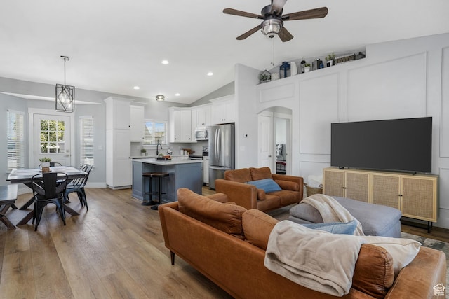 450 N 200 E, Lehi, UT 84043 - living area featuring a ceiling fan, vaulted ceiling, wood finished floors, recessed lighting, and arched walkways