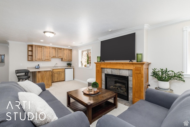 841 E 5875 S, South Ogden, UT 84405 - living room featuring crown molding, a fireplace, light colored carpet, and recessed lighting